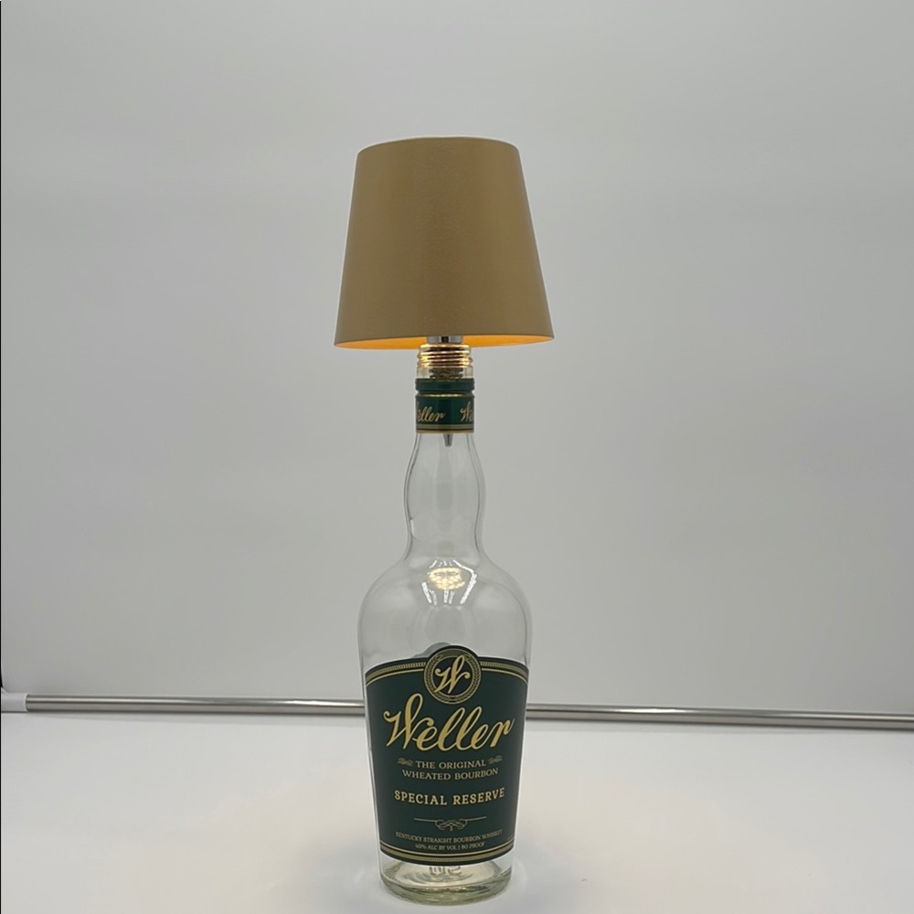 Bottle Lamp with Gold shade.